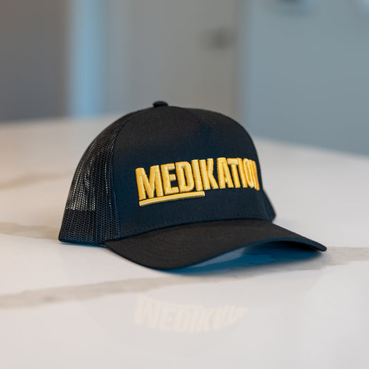 MEDIKATION Gold-Stitch Trucker Hat — front view