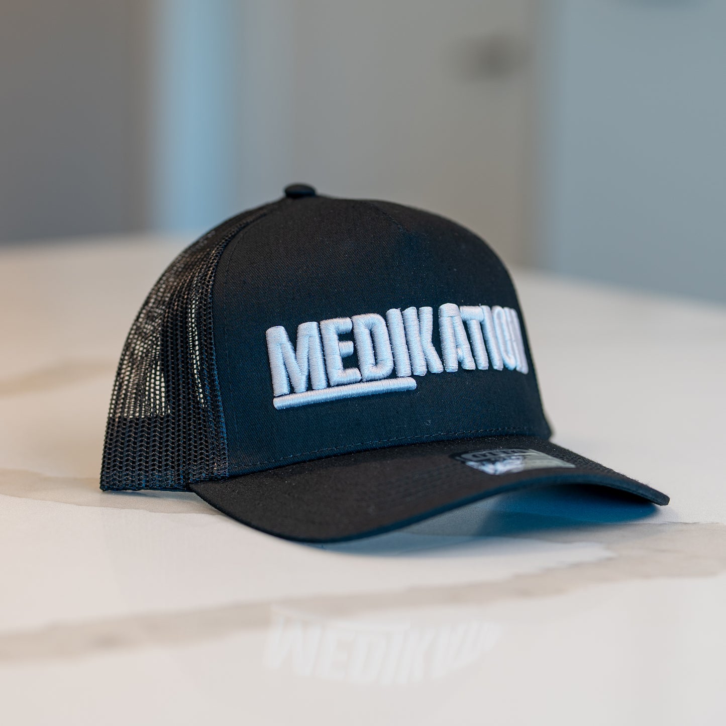 MEDIKATION Grey-Stitch Trucker Hat — front view